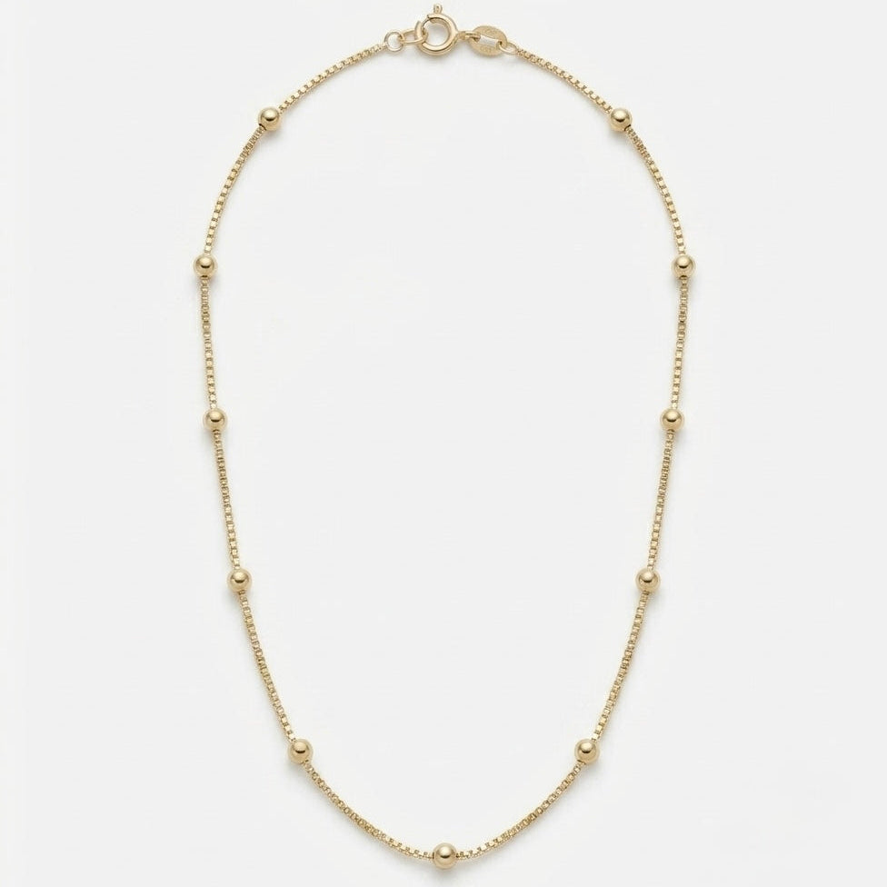 Gold necklace on a white background, gold filled