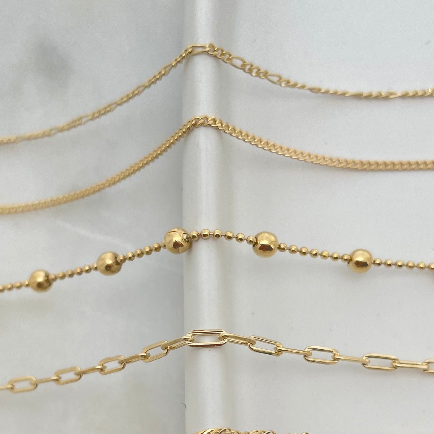 Close up to dainty chains in gold filled