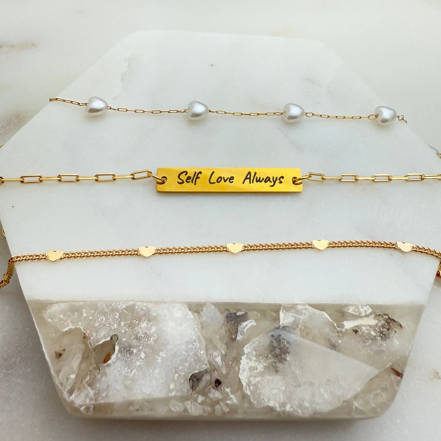 Front view of set of 3 love bracelets, heart bracelets and engraved motivational bracelet