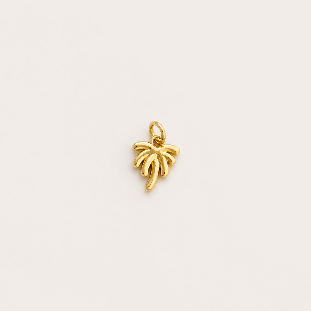 Tiny Palm tree charm a white background