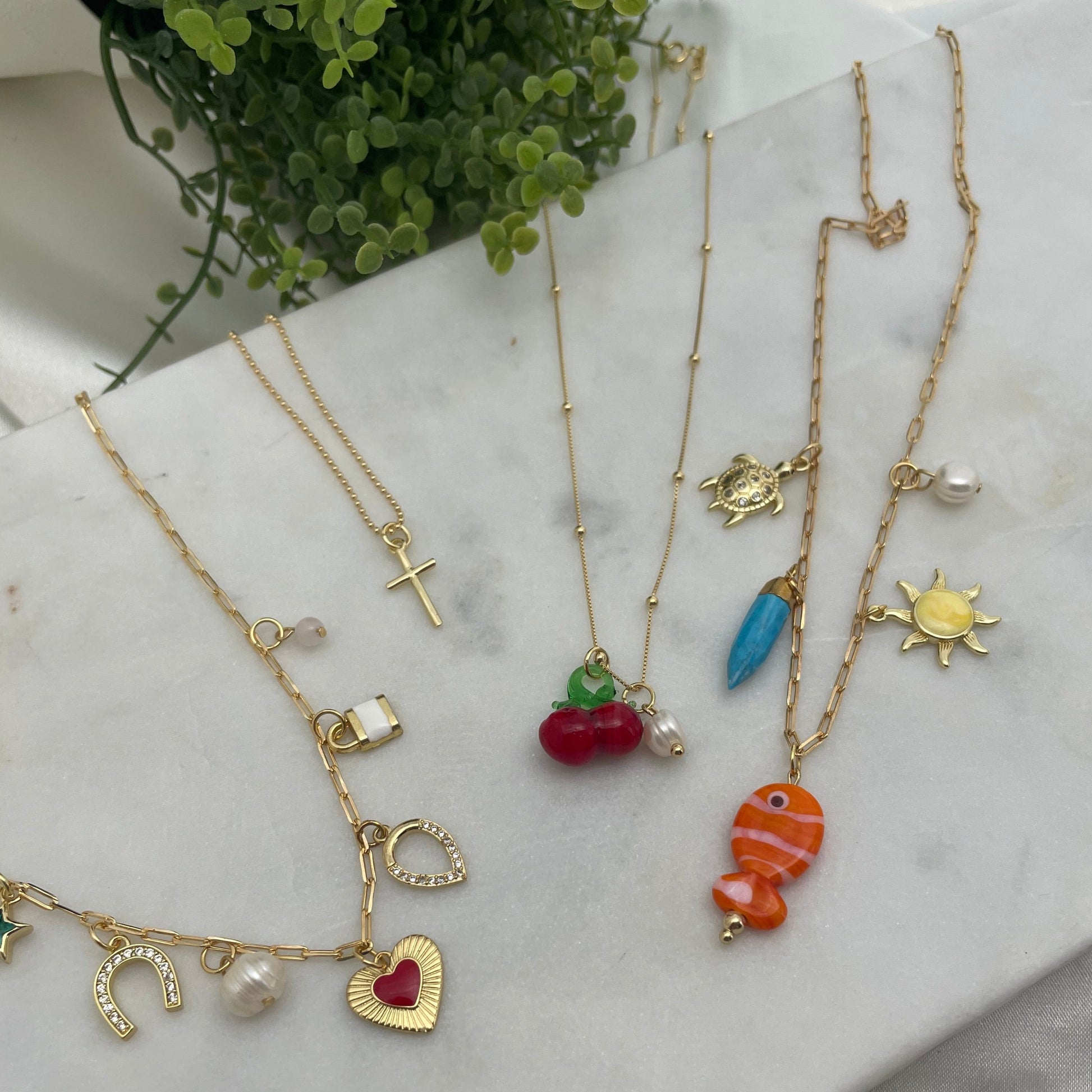 Charm necklaces in 18k gold filled