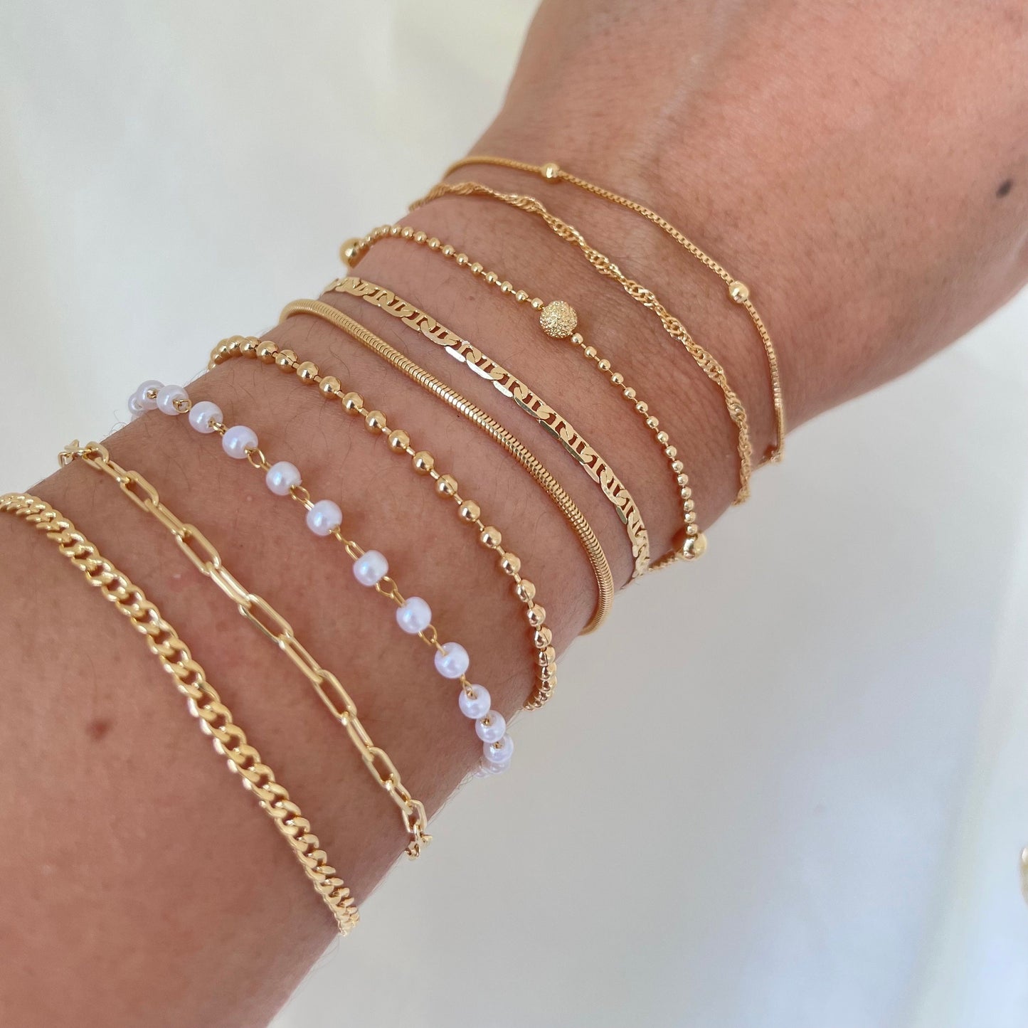 Dainty bracelets, satellite chain, singapur chain, beaded satellite bracelet, mariner bracelet, snake bracelet, beaded bracelet, pearl bracelet, paperclip bracelet, curb chain bracelet all in 18k gold filled, luxury shot