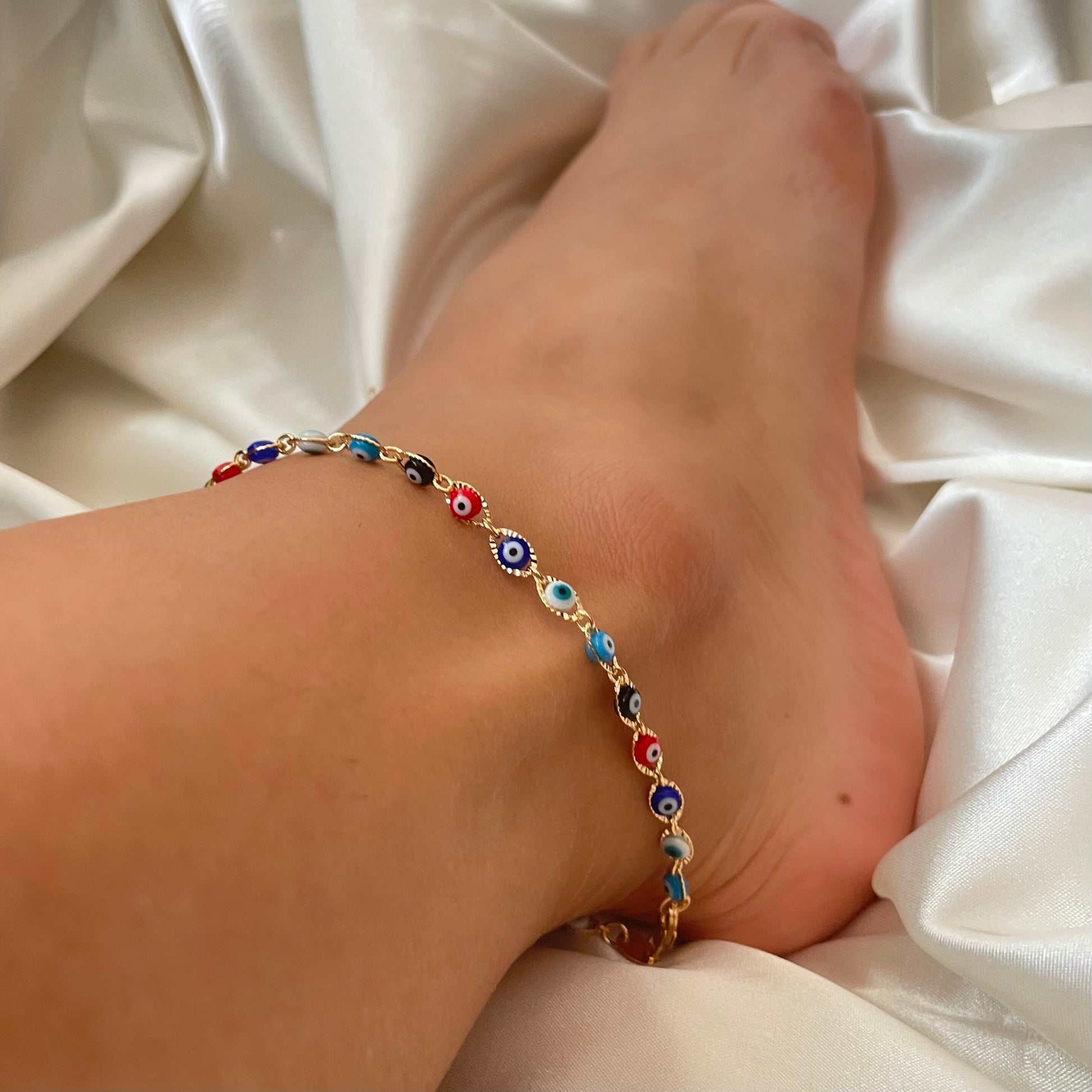 woman wearing a Multicolor evil eye anklet in 18k gold filled 