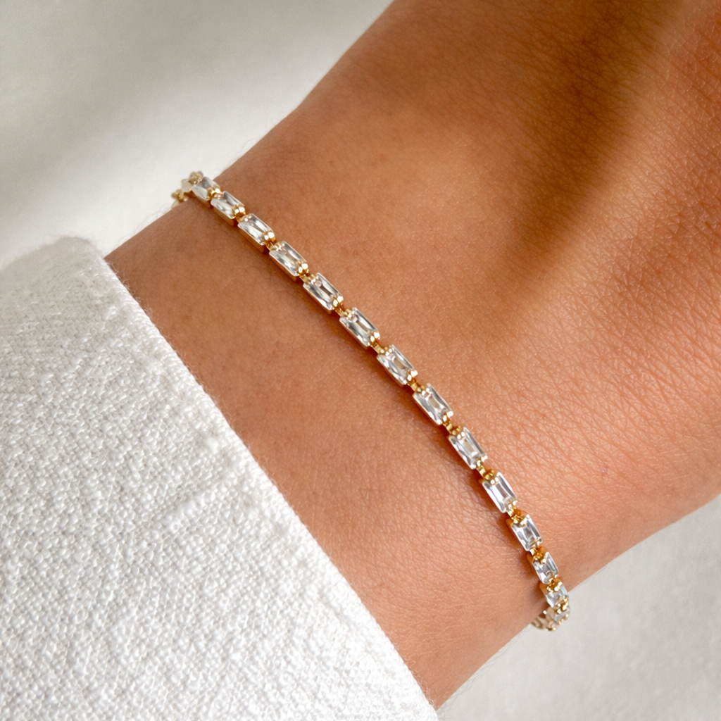 Baguette Bracelet with clear gemstones on a wrist against a white background