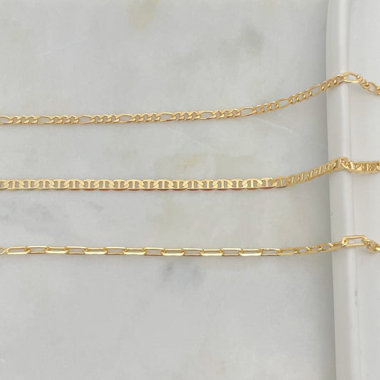 3 styles of anklet bracelets in 18k gold filled, featuring figaro chain anklet, flat mariner anklet and paperclip anklet bracelet. 