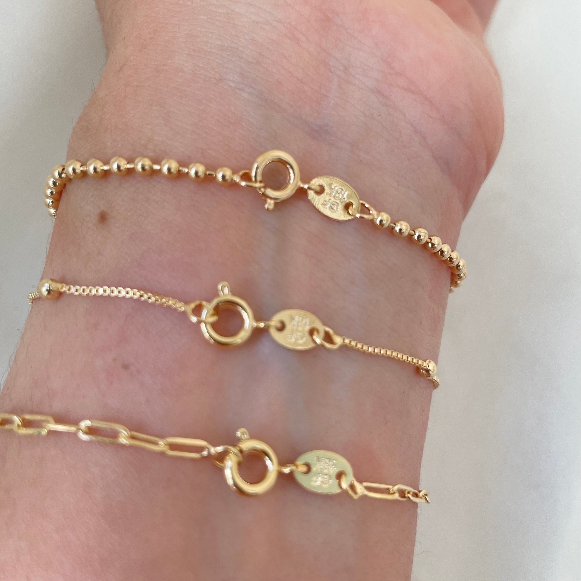 Spring ring clasp of Set of 3 dainty bracelets, paperclip, satellite and beaded bracelet all in 18k gold filled