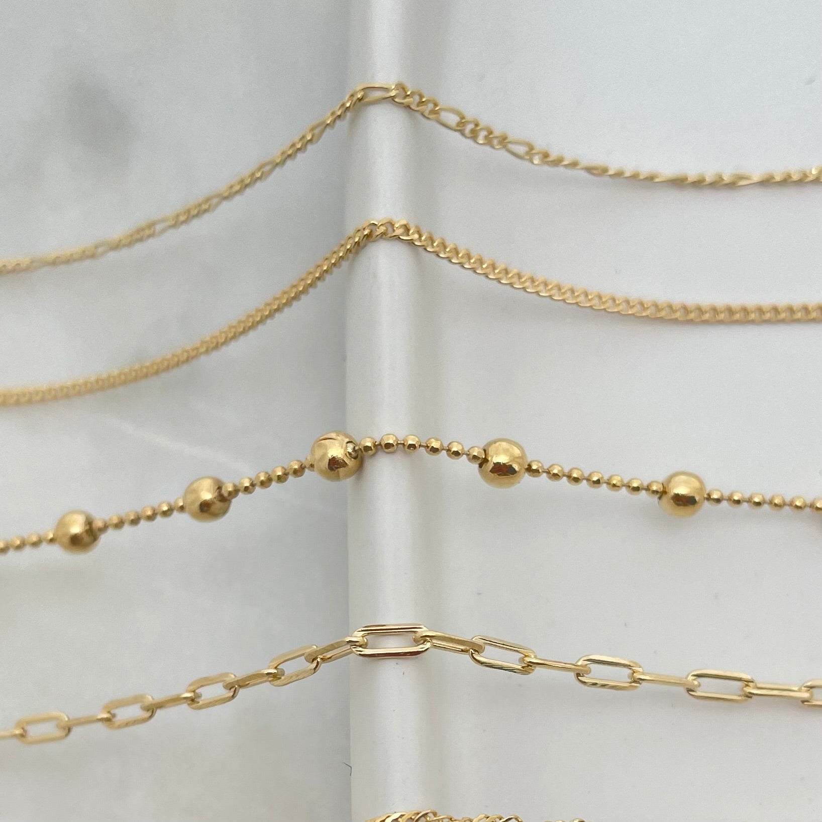Close up to dainty chains in gold filled 