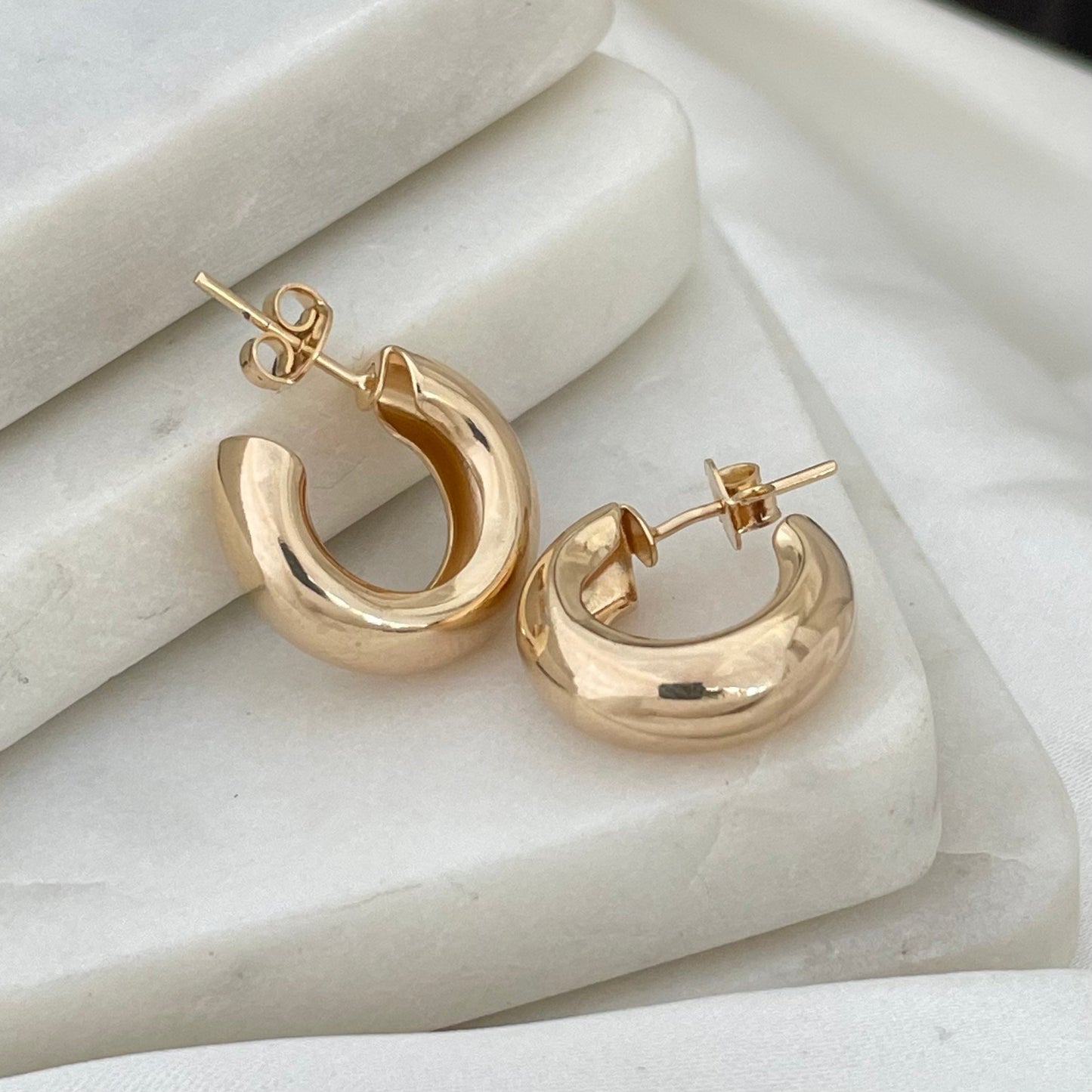 close up to Small open classic hoop earrings in 18k gold filled