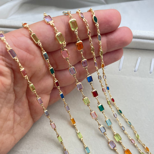 A multicolor gold-filled necklace with various colored crystals on a chain.