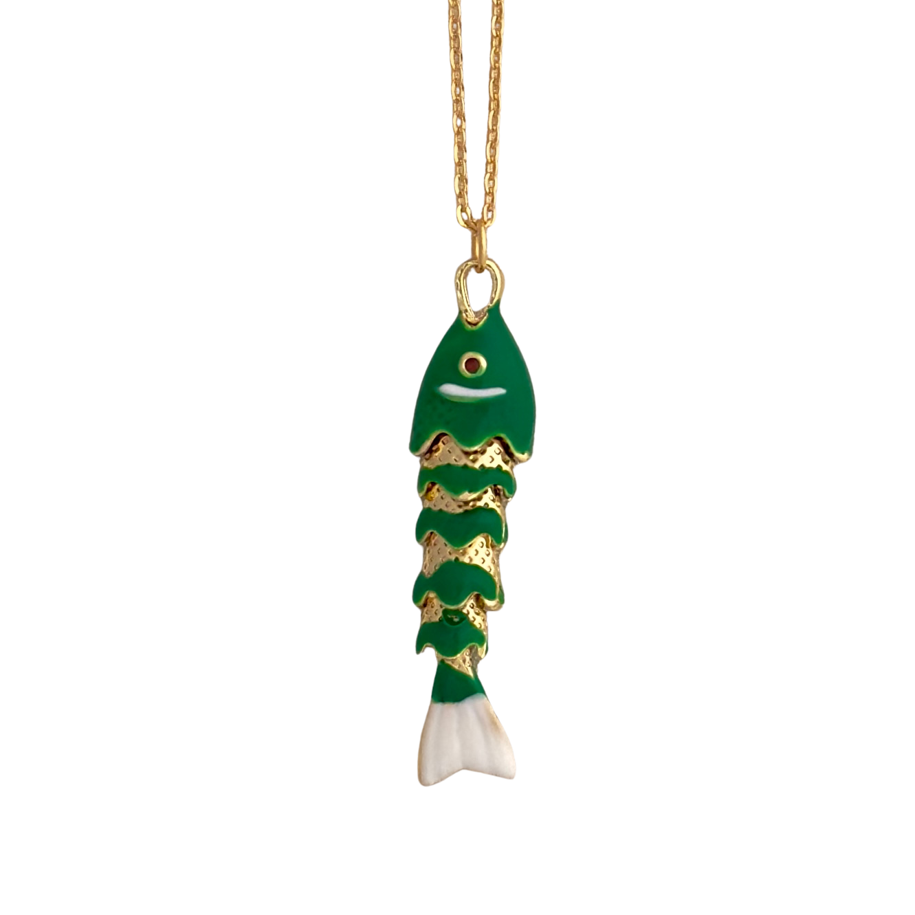 Green and white enamel fish, white background.