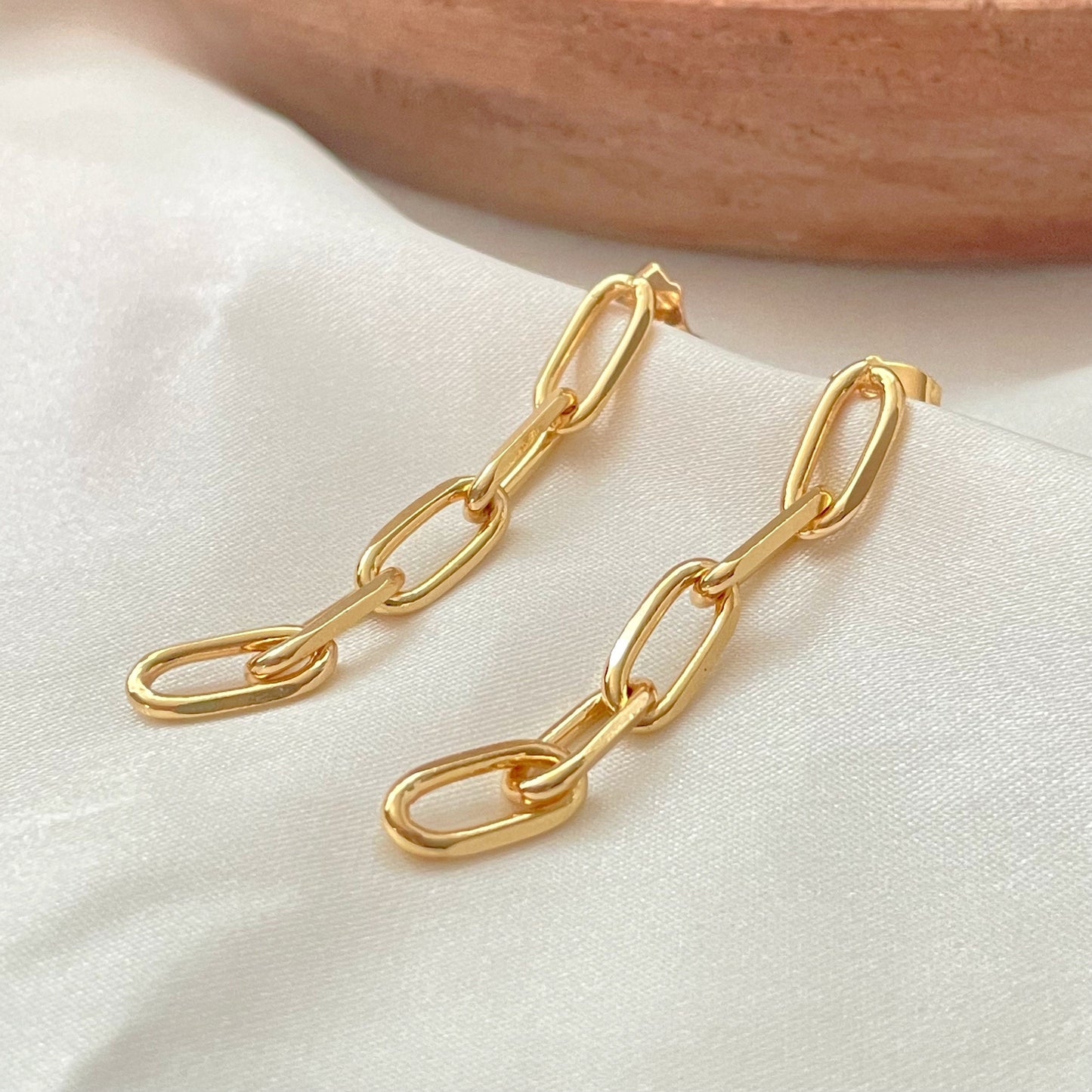 Paperclip dangle earrings in 18k gold filled silky background