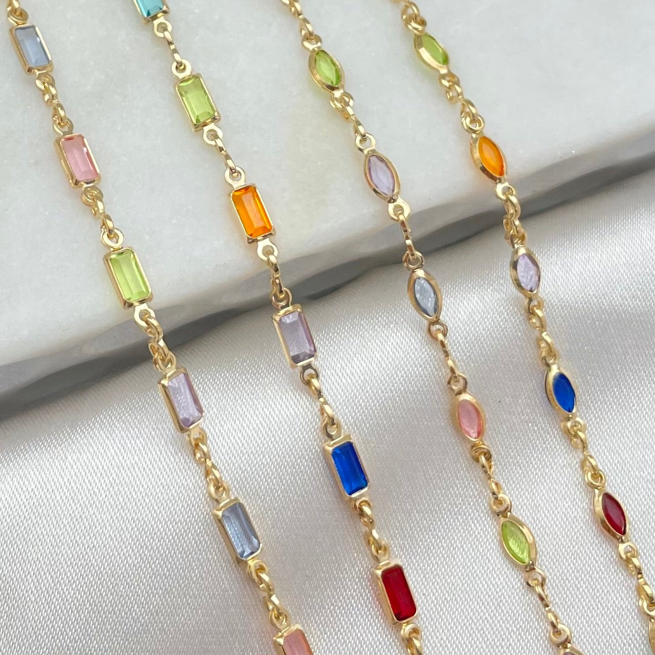 Close up to rectangular and oval shape crystal necklaces