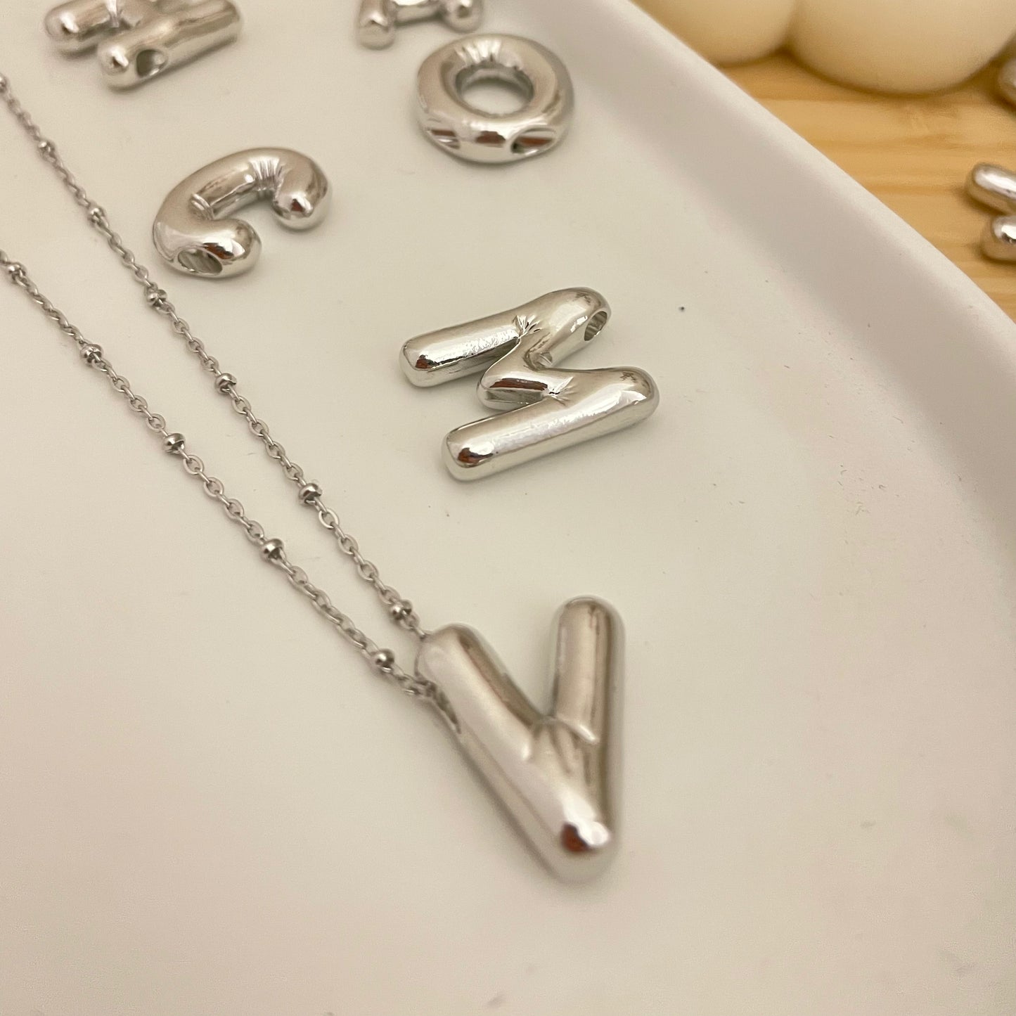 V Initial Pendant Silver Plated over white tray 
