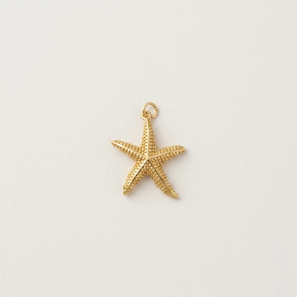 Gold Plated Starfish over white background