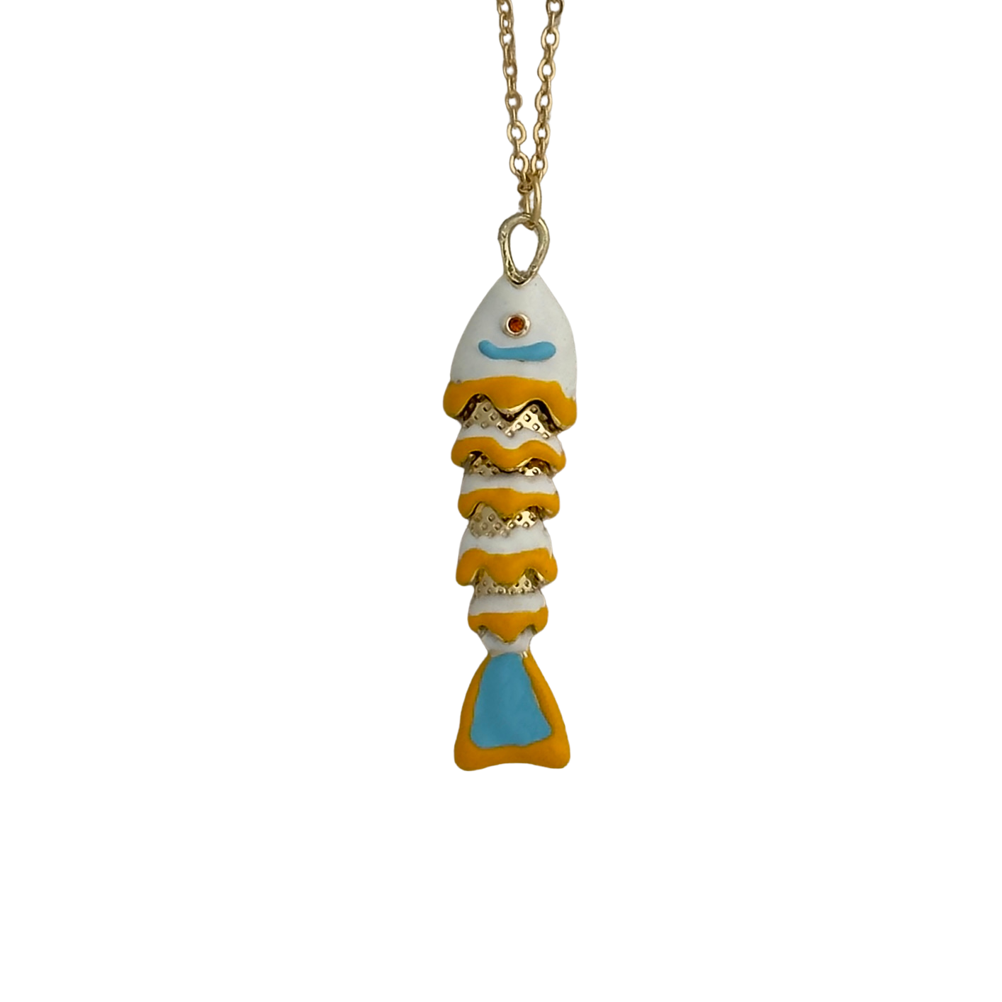 White, orange, and light blue enamel fish on a white background.