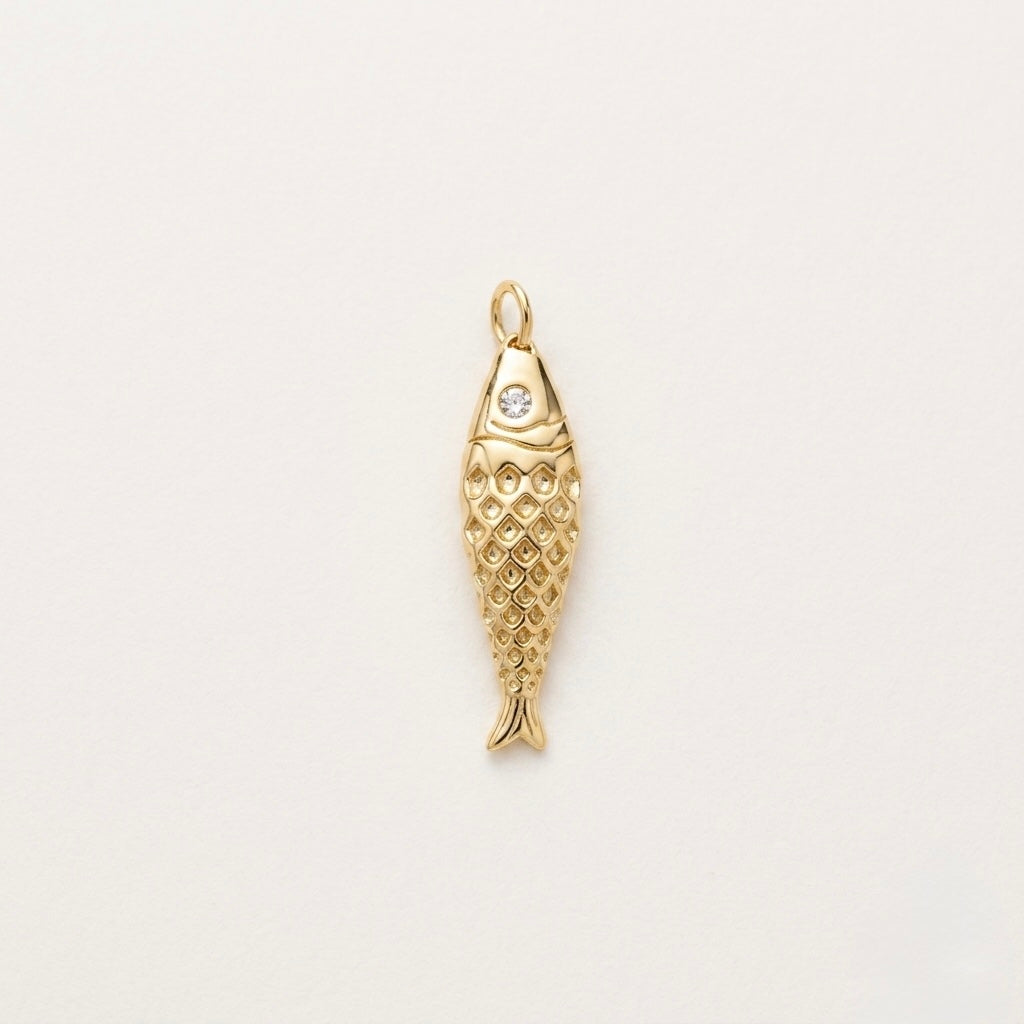 Gold plated fish textured with crystal simulating an eye
