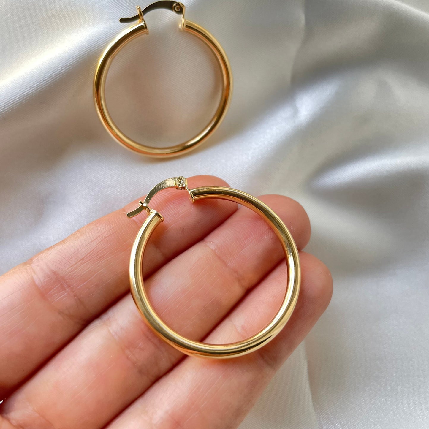 Hold in hand one hoop earring material 18k  gold filled 