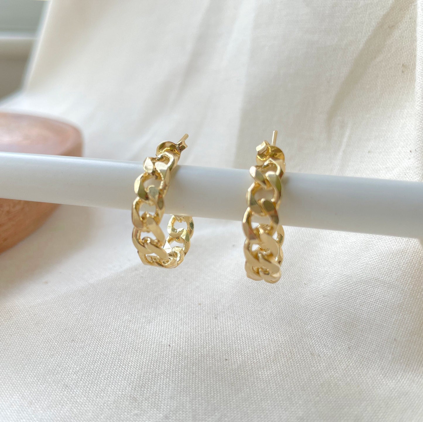 Front view of 18k gold filled curb chain hoop earring, thick open hoop, push back earring. White background 