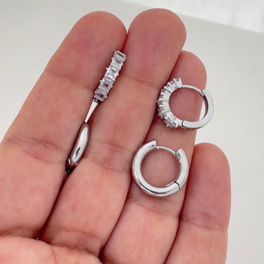 Cube cubic zirconia rhodium filled hoop earrings and plain hoop earrings. Hold in hand. Huggie earrings