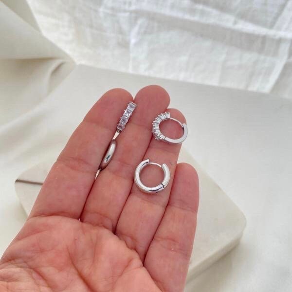 Cube cubic zirconia rhodium filled hoop earrings and plain hoop earrings. Hold in hand. Huggie earrings