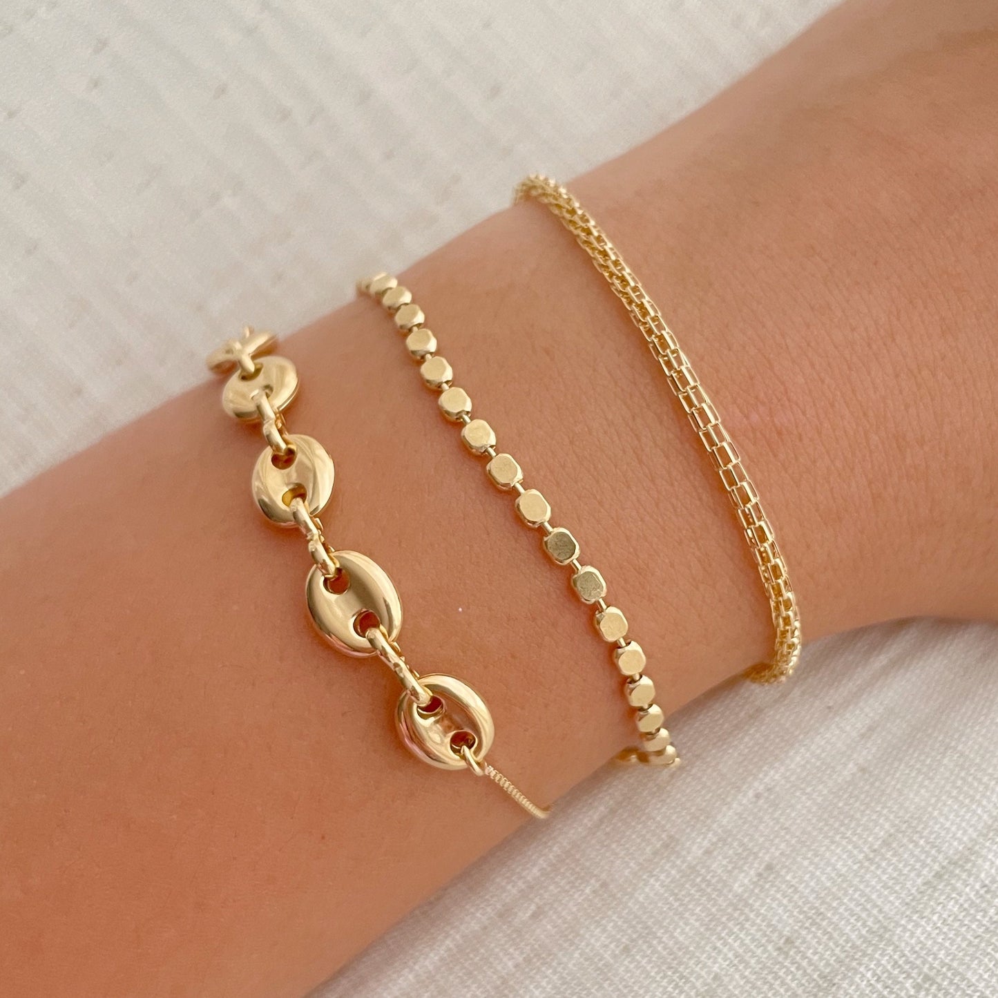 Bracelets on wrist, made of gold filled, 3 styles puffed link adjustable bracelet, dot bracelet, tube bracelet