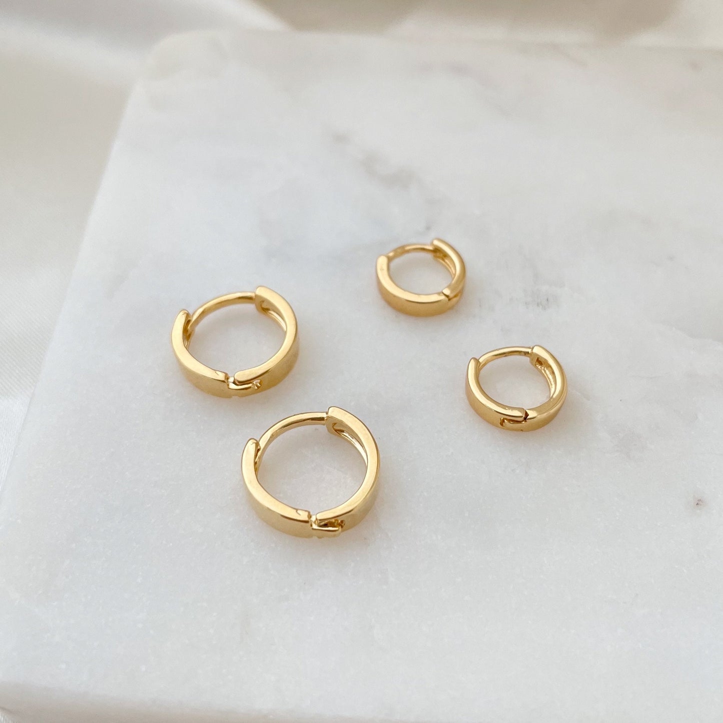 Set of two everyday huggie hoop earrings in 18k gold filled